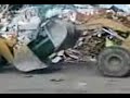 CAR CRUSHING BY TWO CAT SHOVELS. CAR CRUSHING BY TWO CAT SHOVELS.
