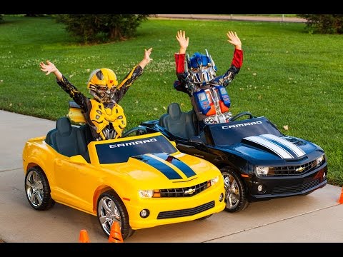 Transformers Power Wheels Race - Bumblebee vs Optimus Prime!
