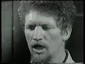 Luke Singing The Foggy Dew {1966}for German television called 'LIED FÜR TRÄÜMER MÜISK FÜR REBELLEN' translate to 'Songs For A Dreamer Music For Rebels.
The Foggy Dew was written by Canon Charles O`Neill in 1919.

As down the glen one Easter morn to a city fair rode I
There Armed lines of marching men in squadrons passed me by
No fife did hum nor battle drum did sound it's dread tatoo
But the Angelus bell o'er the Liffey swell rang out in the foggy dew

Right proudly high over Dublin Town they hung out the flag of war
'Twas better to die 'neath an Irish sky than at Sulva or Sud El Bar
And from the plains of Royal Meath strong men came hurrying through
While Britannia's Huns, with their long range guns sailed in through the foggy dew


But the bravest fell, and the requiem bell rang mournfully and clear
For those who died that Eastertide in the springing of the year
And the world did gaze, in deep amaze, at those fearless men, but few
Who bore the fight that freedom's light might shine through the foggy dew