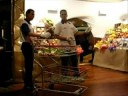 3 robotic mannequins (Denis, Lafaiete and Borba) sell fruits to a customer robotic mannequin (Thais), in an event for VISA cards, in Sao Paulo, Brazil.Vitrine viva no Mercado Municipal de São Paulo, para os cartões VISA
