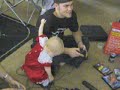 Baby wants to play playstation.