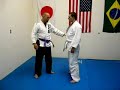 Brazilian Jiu-Jitsu Instruction: T-Clinch to Rear Takedown