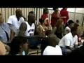 Shaq and wife watching his son Shareef