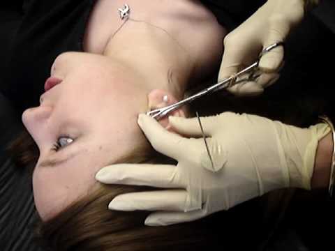 Me getting my tragus pierced at Body Art & Tattoo in burlington. :) Me getting my tragus pierced at Body Art & Tattoo in burlington. :)