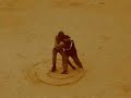 Dancing Tango and drawing YinYang in the sand