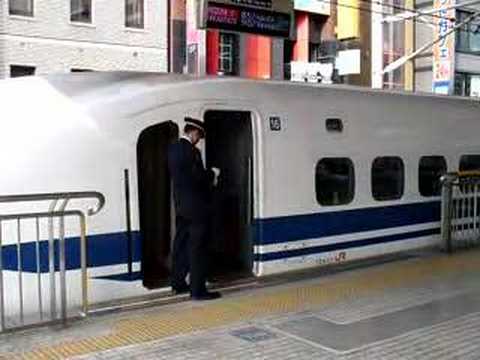 JR Shinkansen Conductor welcomes passengers
