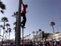 Beach Performer on 12 foot unicycle juggling Beach Performer on 12 foot unicycle juggling