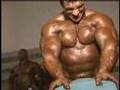 Bodybuilder Paco Bautista pumping backstage