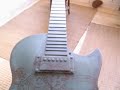 filmed by artist mauricio ortiz, this short clip shows the 10ft fibreglass gibson guitar replica designed and painted by mauricio for the gibson guitar town london 2007 exhibition. mauricio collaborated directly with led zeppelin singer robert plant on the concept, and the completed artwork was eventually sold at auction for charity (the prince's trust, nordoff robins music therapy and teenage cancer research) after having been shown on london's south bank 'more london' space for three months. titled 'armes prydein', the work is mauricio's interpretation of various elements of the 'dreamland' album cover imagery incorporated onto the 'weathered' metallic surface of this mammoth instrument, which has sunk to bottom of the ocean - as heavy metal does when lured by the sirens - and is gradually being claimed as a home by the sea-life.