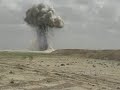 A group of soldiers destroy a munitions dump in Iraq from ab