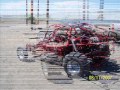 sand rail climbing over hill 49