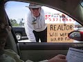 Sign of the Times: Realtor Drums up Business on the Street Sign of the Times: Realtor Drums up Business on the Street