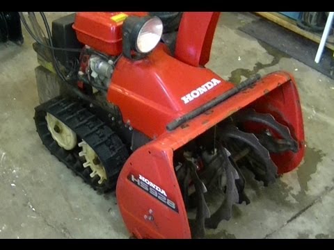 how to adjust auger belt on snowblower