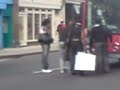 woman blocks off 3 long bendy buses with wheelchair