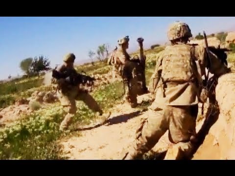 gunner - A M249 machine gunner runs directly towards a hail of Taliban PKM machine gun fire and RPGs, laying down suppressing fire once he makes it to cover. From the...