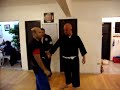 Defense against a Roundhouse Punch or Open Hook Punch Defense against a Roundhouse Punch or Open Hook Punch