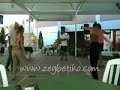 Turkish Sirtaki trainers Bahattin and Nursen, whom also known as Heybetiko and Heybetika are at a sirtaki lesson in Prinkipo. They are practicing zeibekiko with their students. They are teaching them zeibekiko which is said to be the unteachable dance. Heybetiko ve Heybetika lakapli turk sirtaki egitmenleri, bahattin ve nursen, istanbul - buyukada'da bir sirtaki dersindeler, ogrencileri ile birlikte zeybetiko (zeybetiko - zeimpekiko) calismasi yapiyorlar, onlara ogretilemez denilen dansi ogretiyorlar
