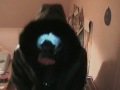 lady marjana wears her gasmask to the long leathercoat