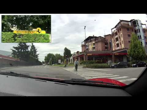 maranello - A drive through Maranello in Italy in a red Ferrari 360 Spider. Starting at Hotel Maranello Village, a hotel and apartments where a lot of Ferrari employees ...