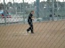 mrs. white playing softball.