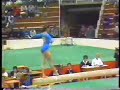 gymnast doing round off off the end of the beam through to a back pike