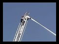 Female Firefighter Climbs Fully Extended 107\ Female Firefighter Climbs Fully Extended 107\