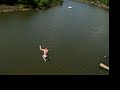 jumping out of a tree on top of a cliff jumping out of a tree on top of a cliff