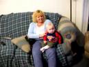 Joe playing uilleann pipes for granson Tommy