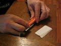 Rolling a cigarrette with a rolling machine