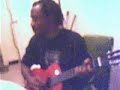 Jean Robert Bonjean playing the guitar