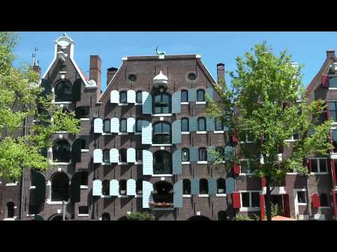 amsterdam - http://www.inyourpocket.com A tour of Amsterdam from the Central Station past the massive Bicycle Park (Fietsflat) to Dam Square, the Royal Palace and the Na...