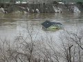 house floating down river.