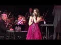 Idina Menzel, with Marvin Hamlisch conducting the Pasadena Pops, sang circles around standards, classic pop and her Broadway best at the Greek Theater in hills of Griffith Park in Los Angeles.