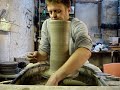 throwing a big tall large clay pottery vase quickly on a wheel potters wheel. ingleton pottery www.ingletonpottery.co.uk