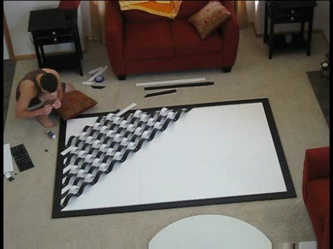 wall art - Doing exactly what the title of this piece says, using foam board, poster board, push pins, spray paint, tacky glue and tons of patience. For this and more v...