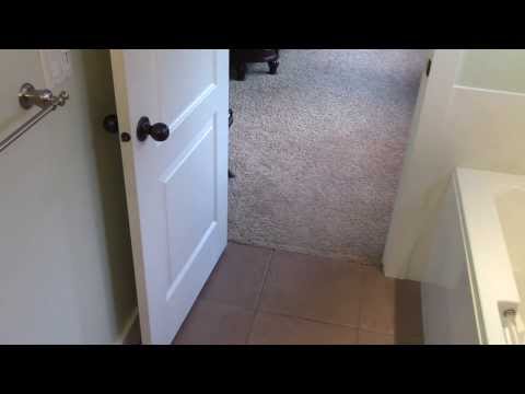 how to fix a door that swings open by it self
