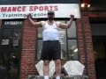 Musclebear flexes in front of TPS after pumping up