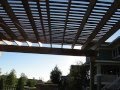 Cedar Pergola with Fireplace and Patio by St. Croix Exteriors