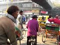 I wait at a stoplight on the rickshaw.