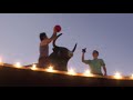 Amazing footballers jump bull