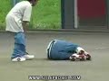 skater jumps off roof on inline skates the landing dosent go so well....as you can see.