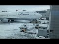 Truck Spins Tires Trying to Tow Lufthansa Plane December 2010 European Snow Storm HD