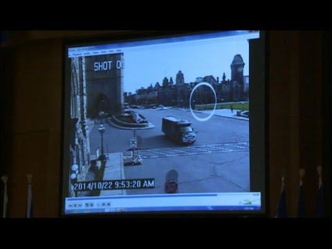Ottawa - RCMP Commissioner Bob Paulson shows surveillance footage of yesterday's attack on Parliament Hill.
