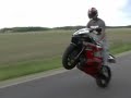standing on the gas tank one handed wheelies an stand up wheelies