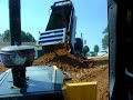 Kenworth  dump truck dumping dirt