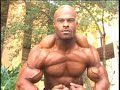 Bodybuilder Kevin LeDoux poses biceps outdoors Bodybuilder Kevin LeDoux poses biceps outdoors
