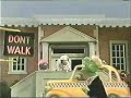 classic sesame street   the sign says dont walk