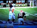 Hawaii Football Player is pushed by Georgia's Punter