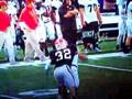 Hawaii Football Player is pushed by Georgia's Punter