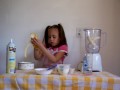 Natalie making a banana yogurt smoothie